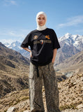 DAXUEN black oversized gold-embroidered shield and polo graphic t-shirt — model photo