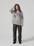DAXUEN Gothic cross print oversized hoodie — model photo