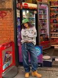 DAXUEN Gothic cross print oversized hoodie — model photo