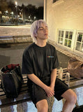 DAXUEN Gothic distressed oversized short-sleeved t-shirt — model photo