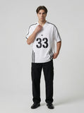 DAXUEN Gothic emblem V-neck T-shirt with printed graphics — model photo