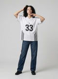 DAXUEN Gothic emblem V-neck T-shirt with printed graphics — model photo