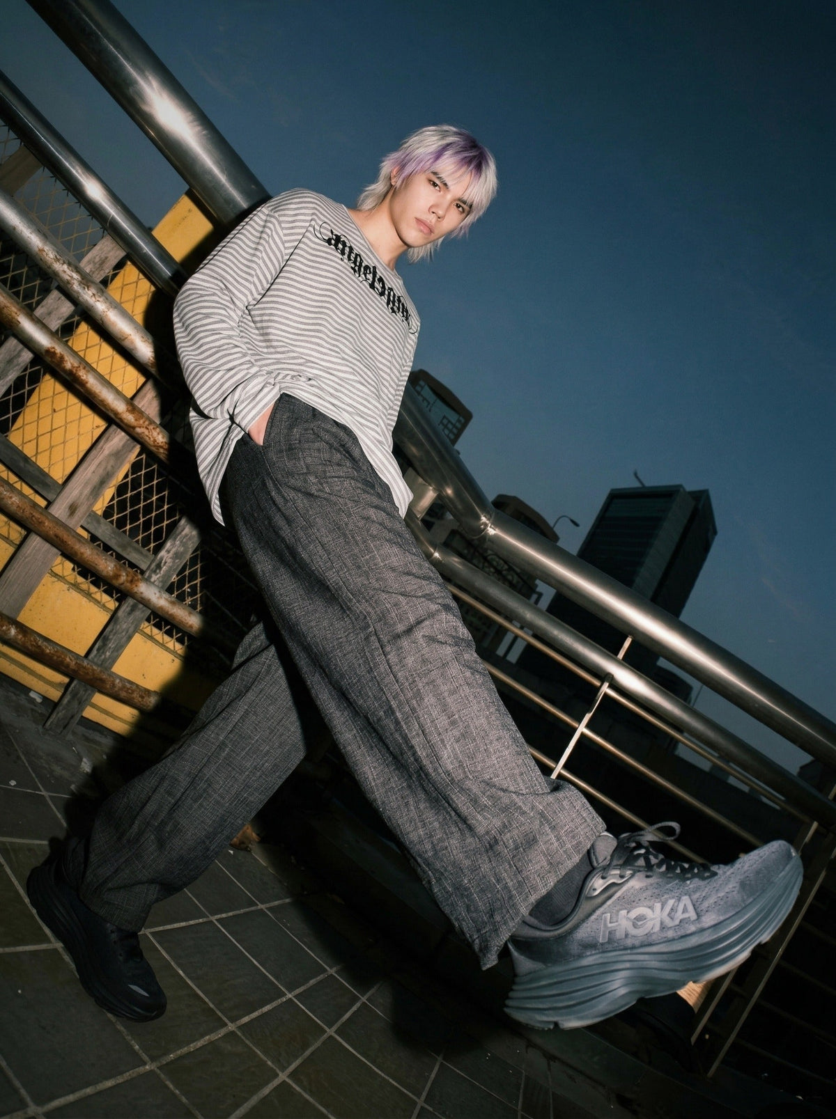 DAXUEN Gothic graphic striped long sleeve top — model photo