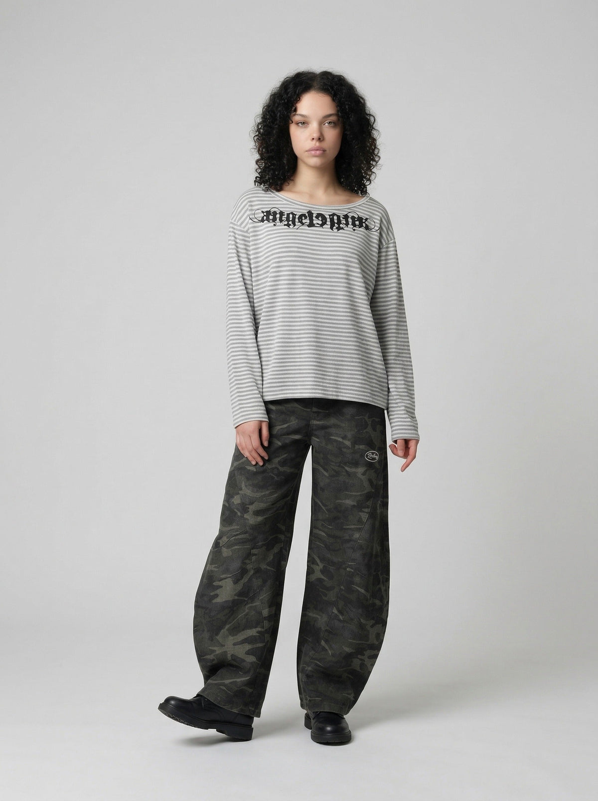 DAXUEN Gothic graphic striped long sleeve top — model photo