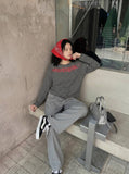 DAXUEN Gothic graphic striped long sleeve top — model photo
