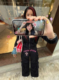 DAXUEN Black wide-leg cargo pants with gothic graphic — model photo