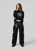 DAXUEN Black wide-leg cargo pants with gothic graphic — model photo