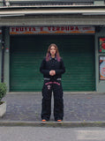 DAXUEN Black wide-leg cargo pants with gothic graphic — model photo