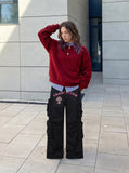 DAXUEN Black wide-leg cargo pants with gothic graphic — model photo