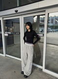 DAXUEN Gothic graphic wide-leg pants with multi-layered waistband — model photo