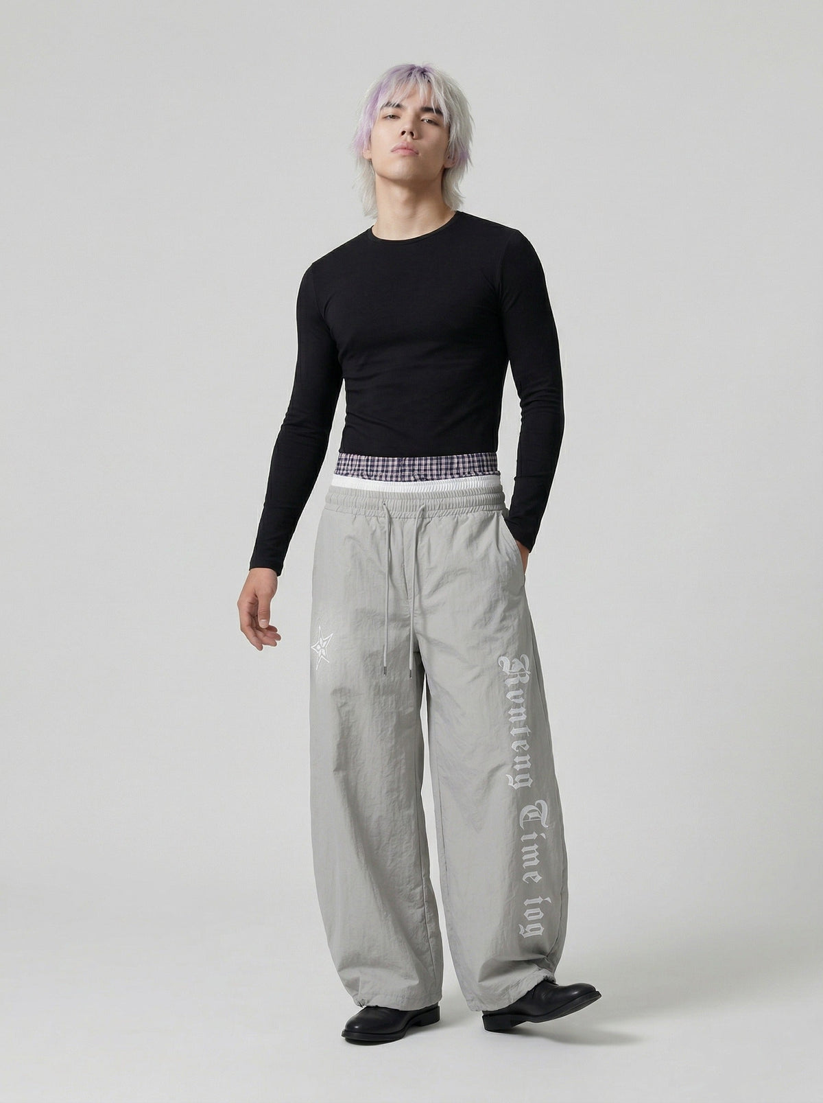 DAXUEN Gothic graphic wide-leg pants with multi-layered waistband — model photo
