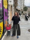 DAXUEN Wide-leg sweatpants with gothic graphic — model photo