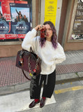 DAXUEN Wide-leg sweatpants with gothic graphic — model photo