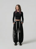 DAXUEN Wide-leg sweatpants with gothic graphic — model photo