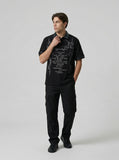 DAXUEN Black short-sleeved polo shirt with graphic print — model photo