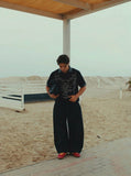 DAXUEN Black short-sleeved polo shirt with graphic print — model photo