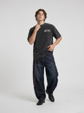 DAXUEN Gothic rhinestone graphic t-shirt in washed black — model photo