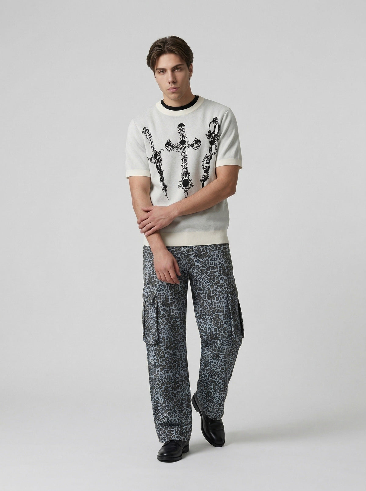 DAXUEN Gothic skull dagger graphic short-sleeve knit top — model photo