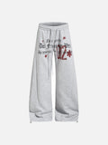 DAXUEN Wide leg sweatpants with gothic text and star graphics