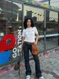 DAXUEN Gothic text asymmetrical short-sleeved T-shirt — model photo