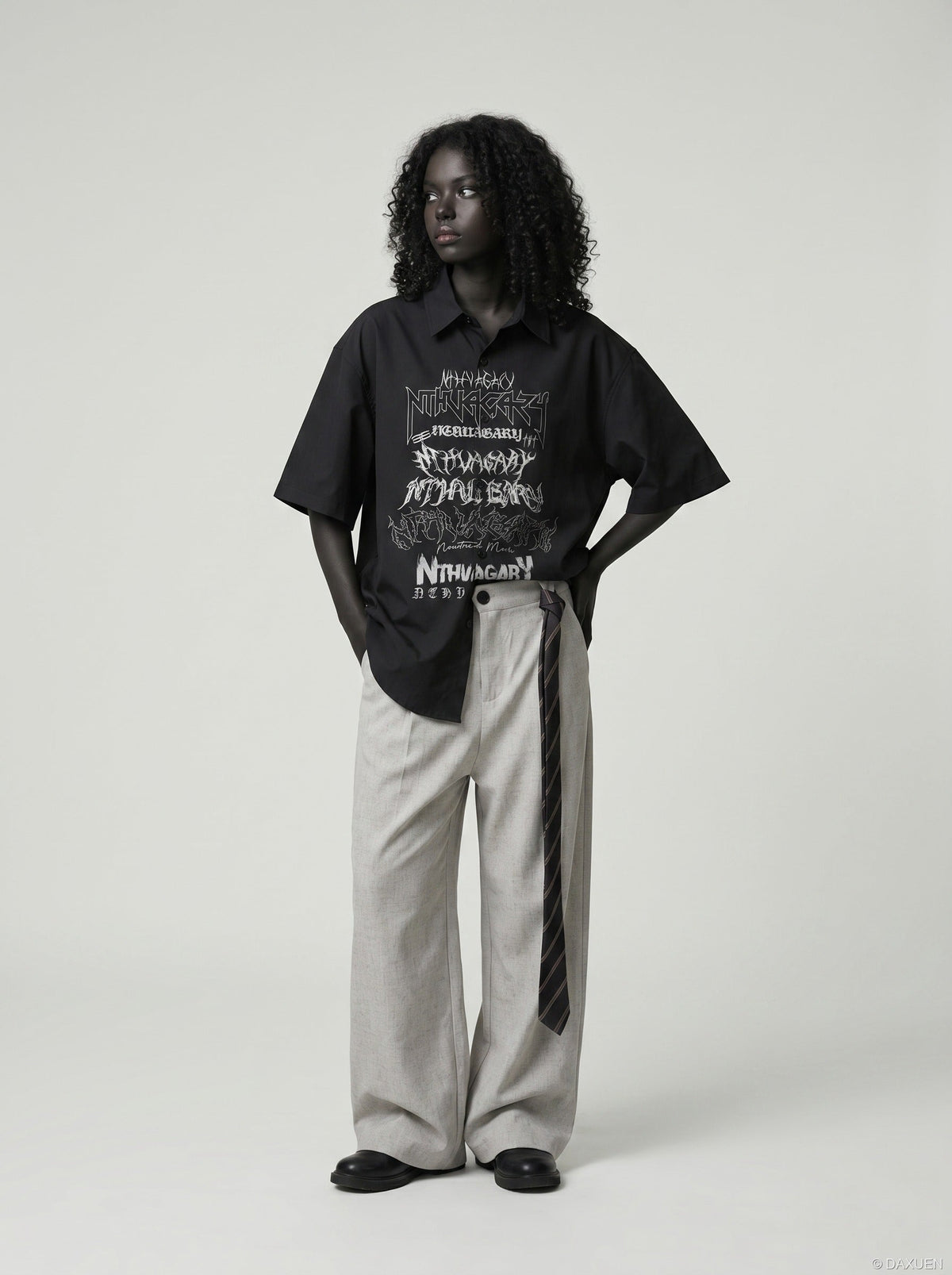 DAXUEN Gothic text button-up shirt in black and white — model photo