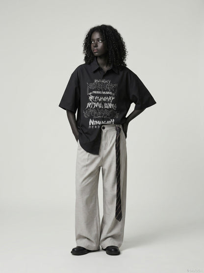 DAXUEN Gothic text button-up shirt in black and white — model photo