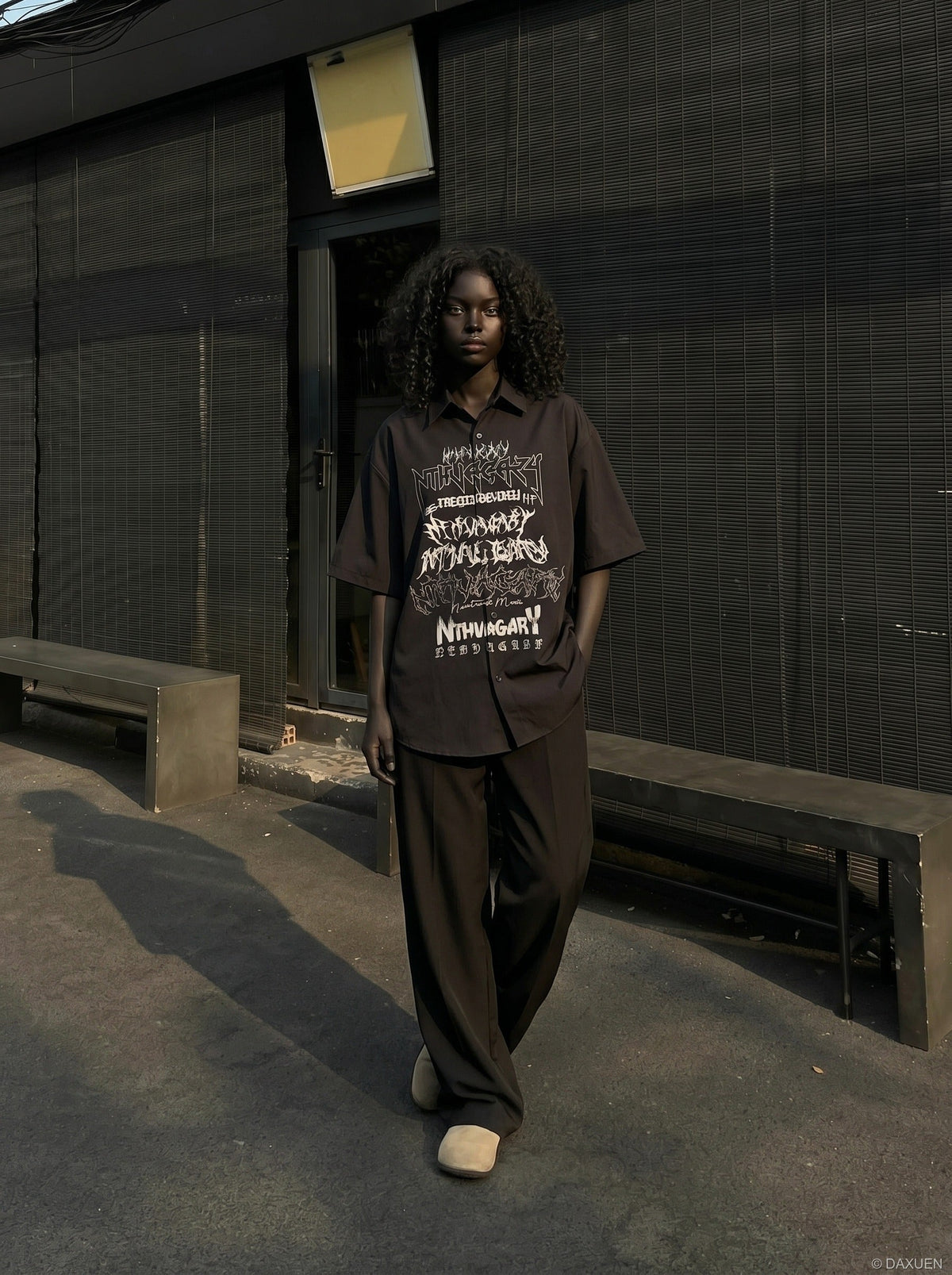 DAXUEN Gothic text button-up shirt in black and white — model photo