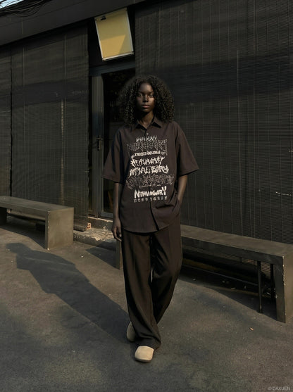 DAXUEN Gothic text button-up shirt in black and white — model photo