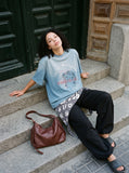 DAXUEN light blue gradient wash abstract face graphic tee — model photo