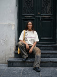 DAXUEN Graffiti print crewneck t-shirt in beige and black — model photo