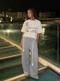 DAXUEN Graffiti print crewneck t-shirt in beige and black — model photo