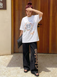 DAXUEN Oversized T-shirt with graffiti print — model photo