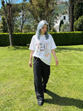 DAXUEN Oversized T-shirt with graffiti print — model photo