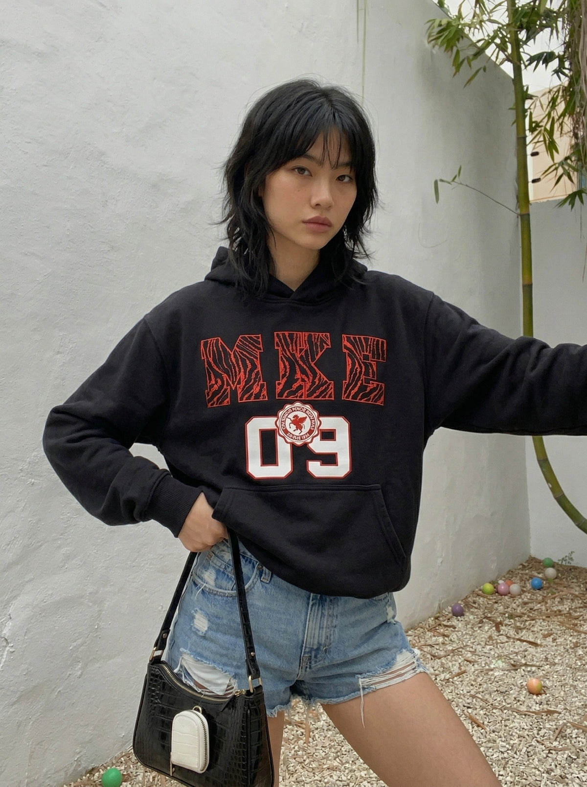 DAXUEN Pullover hoodie with graphic text and kangaroo pocket — model photo