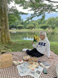 DAXUEN Pullover hoodie with graphic text and kangaroo pocket — model photo