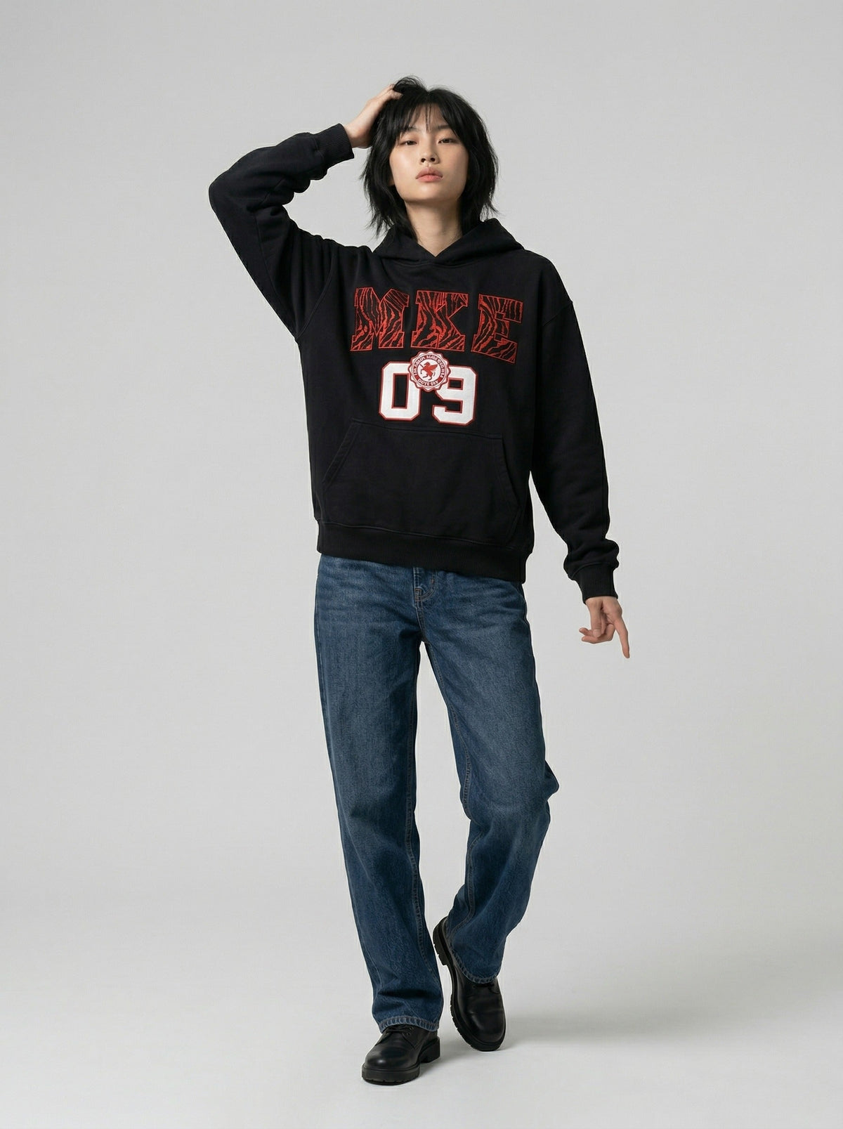 DAXUEN Pullover hoodie with graphic text and kangaroo pocket — model photo