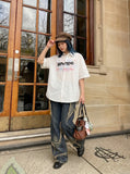 DAXUEN Short-sleeved button-up shirt with graphic print — model photo