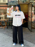DAXUEN Short-sleeved button-up shirt with graphic print — model photo