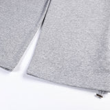 DAXUEN grey and black wide-leg sweatpants with bold cross graphic