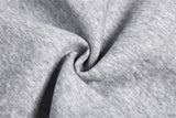 DAXUEN grey and black wide-leg sweatpants with bold cross graphic