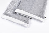 DAXUEN grey and black wide-leg sweatpants with bold cross graphic