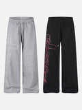 DAXUEN grey and black wide-leg sweatpants with bold cross graphic