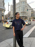 DAXUEN Flecked fabric t-shirt with embroidered graphic — model photo