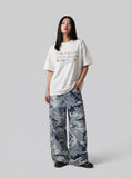 DAXUEN Flecked fabric t-shirt with embroidered graphic — model photo