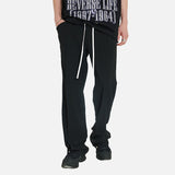 DAXUEN Black oversized graphic T-shirt and wide-leg pants — model photo