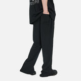 DAXUEN Black oversized graphic T-shirt and wide-leg pants — model photo