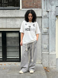 DAXUEN Graphic polo shirt with oversized fit and logos — model photo
