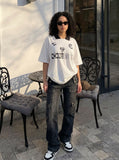 DAXUEN Graphic polo shirt with oversized fit and logos — model photo