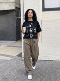 DAXUEN Black short-sleeved graphic t-shirt — model photo