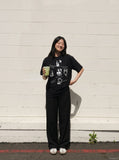 DAXUEN Black short-sleeved graphic t-shirt — model photo